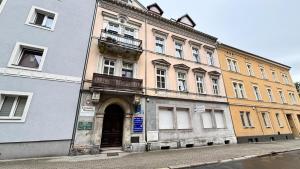 an old building on the side of a street at Friendly House in Bolesławiec