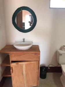 a bathroom with a sink and a mirror on the wall at Thirstybeaver in Playa Santana