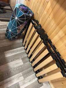 an overhead view of a wooden stairs with a mattress at Смарт-Квартира in Yaremche