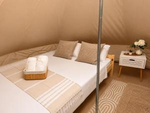 a bedroom with a bed in a tent at VaMood in Vama Veche