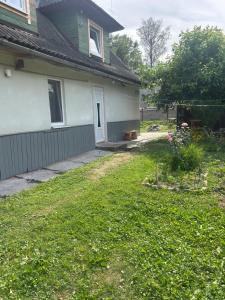a yard in front of a house at Смарт-Квартира in Yaremche +9 photos