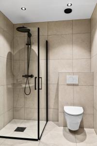 a bathroom with a shower with a toilet in it at Villa in Stryn in Stryn