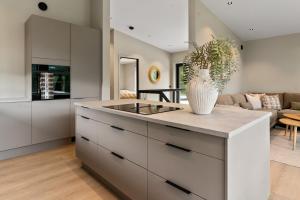 a kitchen with a large island with a vase on it at Villa in Stryn in Stryn