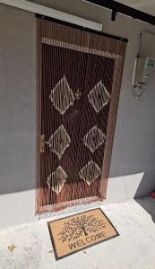 a mesh screen with some fish on it at Daja's Guest House in Shëngjin +3 photos