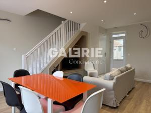 a living room with a table and a couch at GC - Le Caps des Dunes - Centre in Wissant