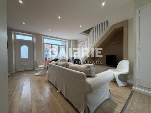 a living room with white furniture and a staircase at GC - Le Caps des Dunes - Centre in Wissant