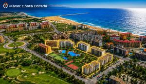 an aerial view of a resort near the ocean at Los Juncos V Apartments in La Pineda