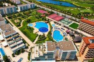 an aerial view of a resort with a pool at Los Juncos V Apartments in La Pineda +51 photos