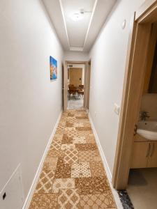 a hallway with a tiled floor and a sink at Auga Apart in Uzungöl +64 photos