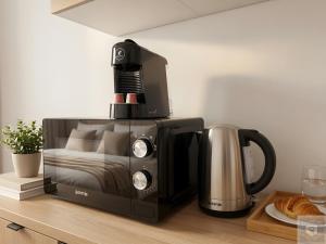 a microwave sitting on a counter next to a coffee maker at RentHouse Apartments-Old Town Studio #2 in Chişinău