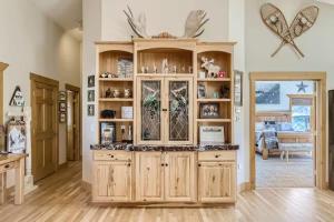 a large kitchen with a large wooden hutch at Mountain Retreat - Deck Views - Sleeps 10 in Black Hawk