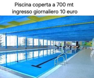 a large swimming pool in a large building at ''BalconyView'' by Staymarilleva1400 in Marilleva