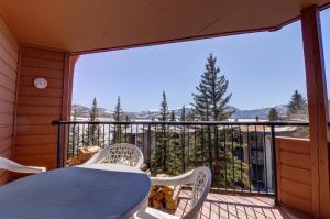 a porch with a table and chairs on a balcony at 432 Marina Place in Dillon