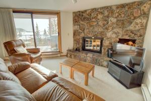 a living room with a couch and a fireplace at 432 Marina Place in Dillon