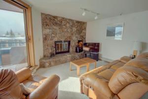 a living room with a couch and a fireplace at 432 Marina Place in Dillon +23 photos