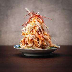 a plate of food with noodles and shrimp on a table at くらしホテル Hakodate in Hakodate