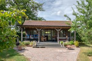 a house with a pavilion in a garden at 3 Bed in Ditchingham oc-s42751 in Ditchingham