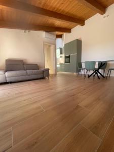 a living room with a couch and a table at Vacanze in centro a un passo dal mare in Montesilvano +3 photos