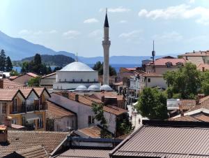a view of a city with a mosque at Golden Age Rooftop Apartment in Ohrid