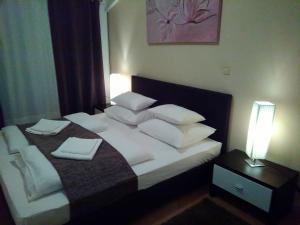 Postel nebo postele na pokoji v ubytování Guest house Garfild 2