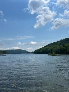 a large body of water with trees in the background at Chalet de toutes saisons in Shawinigan +10 photos