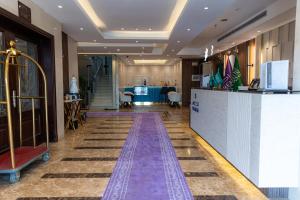 a lobby with a bar in the middle of a building at Akarem New - Al Safa - اكــارم - الصفا in Jeddah