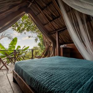 a bedroom with a bed in a room at El Bosque Minca in Minca