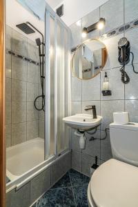 a bathroom with a toilet and a sink and a shower at Home Tatra in Biały Dunajec +73 photos