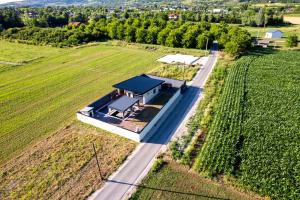 an aerial view of a house in a field at Villa Merak House in Bijelo Brdo
