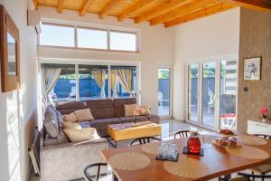 a living room with a couch and a table at Villa Merak House in Bijelo Brdo