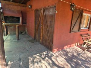 an outside view of a building with a door at Calma chicha casa 1 in Cortaderas