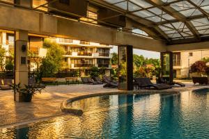 a swimming pool in the middle of a building at Boutique 1BR | Long Beach Sea View Next to the Beach in Shkorpilovtsi