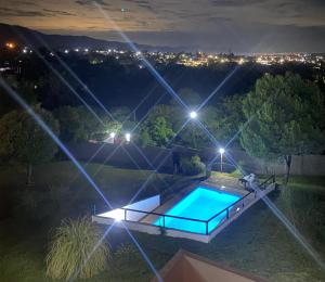 an overhead view of a swimming pool at night at Casablanca in Huerta Grande