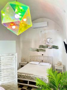 a bedroom with a bed with a stained glass ceiling at Argonaut House in Anafi