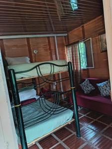 a couple of bunk beds in a room at Altos de Shalem casa canaan in Anolaima +4 photos