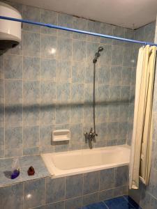 a bathroom with a shower and a bath tub at Villa agamy in Burj al ‘Arab al Jadīdah +5 photos