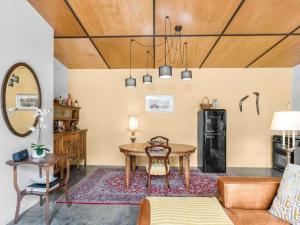 a living room with a table and a couch at Lianna Bungalow in Auburn