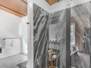 a bathroom with a wall mural of a woman at Lianna Bungalow in Auburn +4 photos