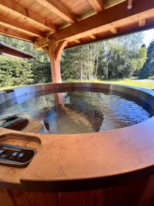 a hot tub in the middle of a table with water at Chalet Isabelle Mountain lodge 5 stars 6 bedroom en suite sauna spa inox in Chamonix