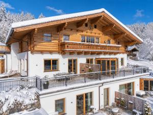 a log home in the snow at Premium XL in Hollersbach im Pinzgau