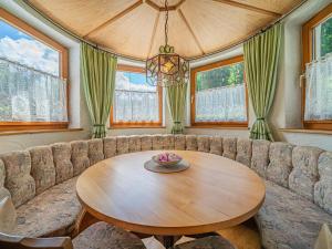 a living room with a couch and a wooden table at Getzfeld-Hof in Westendorf