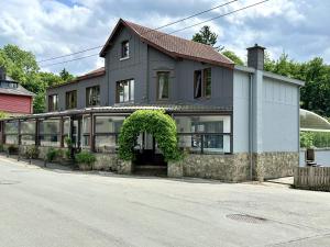 a house on the side of a street at Aux Berges du Lac in Jalhay