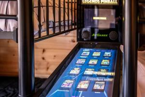 a vending machine filled with lots of cell phones at Top Rated Modern 3BD |Secluded |Fire Pit |Arcade in Sevierville