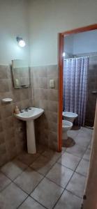 a bathroom with a sink and a toilet at Cabañas fenix alojamiento in San Rafael