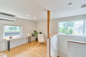 an office with a desk and a window at 藤乃宿 Villa Moere モエレ沼公園すぐ 愛犬と一緒に泊まれる新築1棟貸し in Sapporo +126 photos