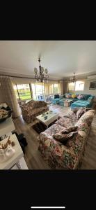 a living room with couches and tables in it at Lavista 7 in Ain Sokhna