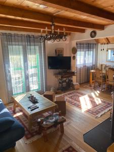 a living room with a couch and a table at Vila Agroturizam Kućica Mostar in Mostar