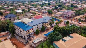 an overhead view of a small town with buildings at GLAMOSSAY HOTEL LIMITED SUNYANi in Abesem