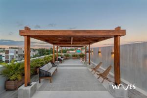 a covered walkway on the roof of a house at Villa morada in Tulum