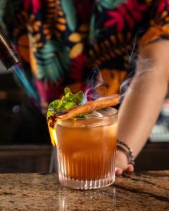 a drink sitting on top of a table at Pipa Bangkok Sukhumvit 11 by Kingston Hotels in Bangkok